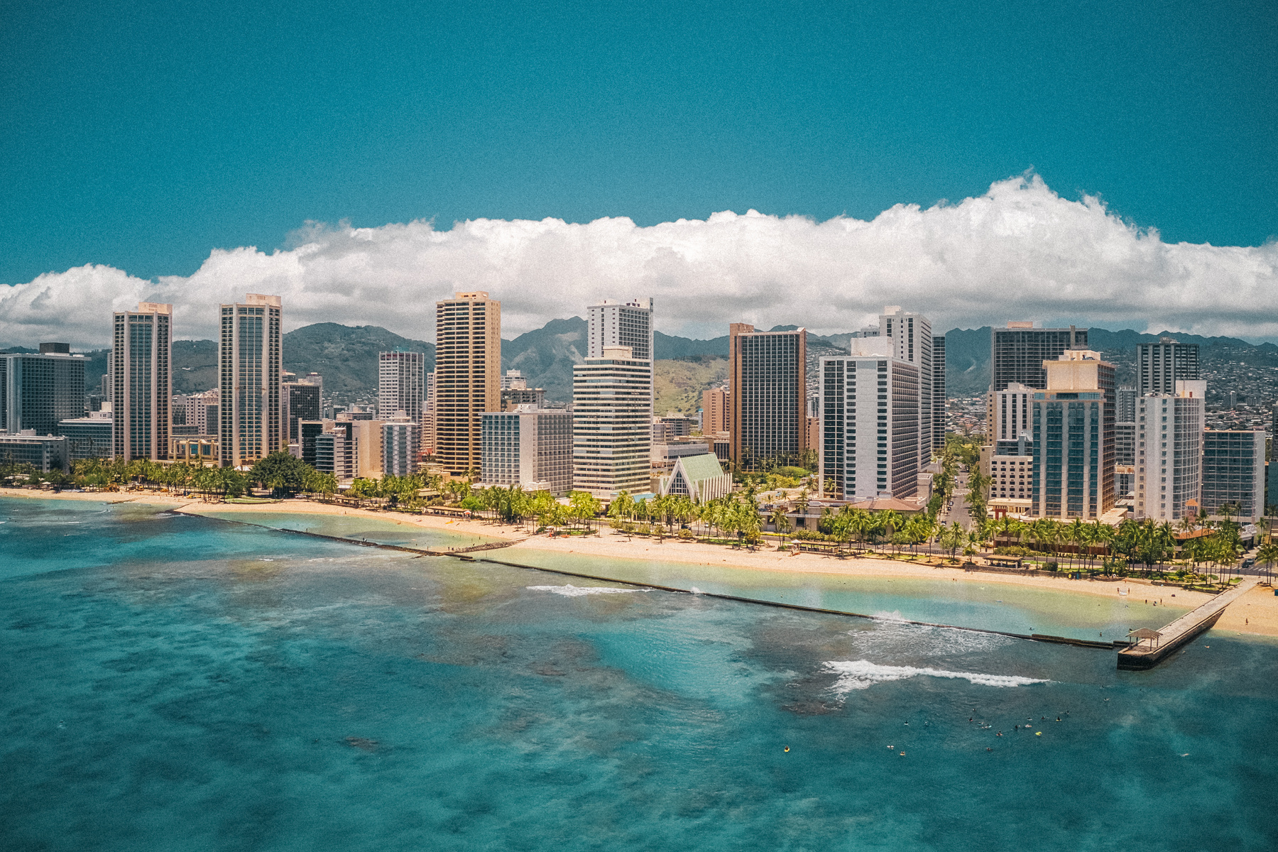 High Rise Buildings Near Sea Under Blue Sky